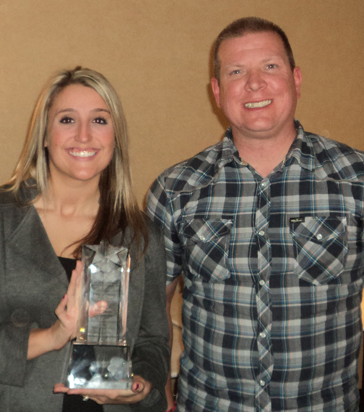 EMC Incentives manager and Southern California Edison SCE energy representative holding award