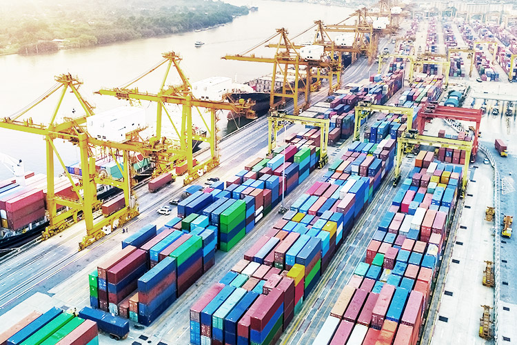 Loading containers at a shipping yard