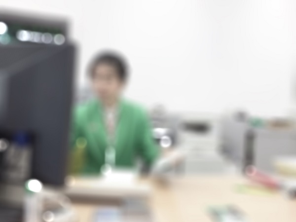 EMC photo of a person at a desk working on a computer